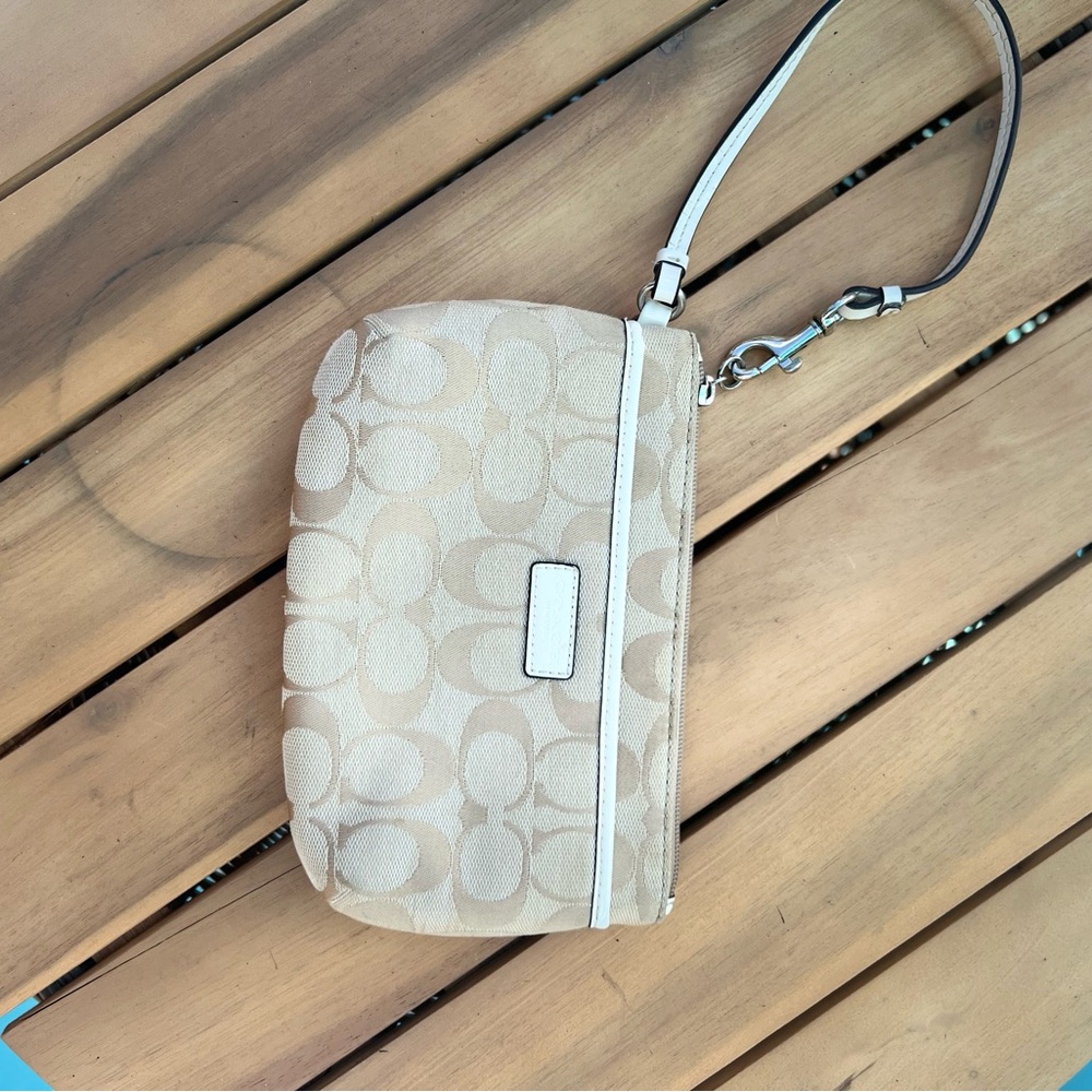 Coach Tan and White Clutch with Signature Monogram